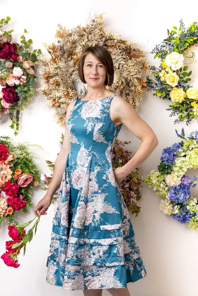 Petalscape owner with wreaths in background